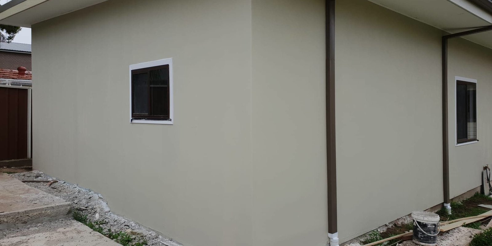 Rendered granny flat exterior with clean modern finish on a Sydney block