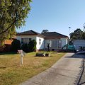 Excavator demolishing an older Sydney home ahead of a knockdown rebuild